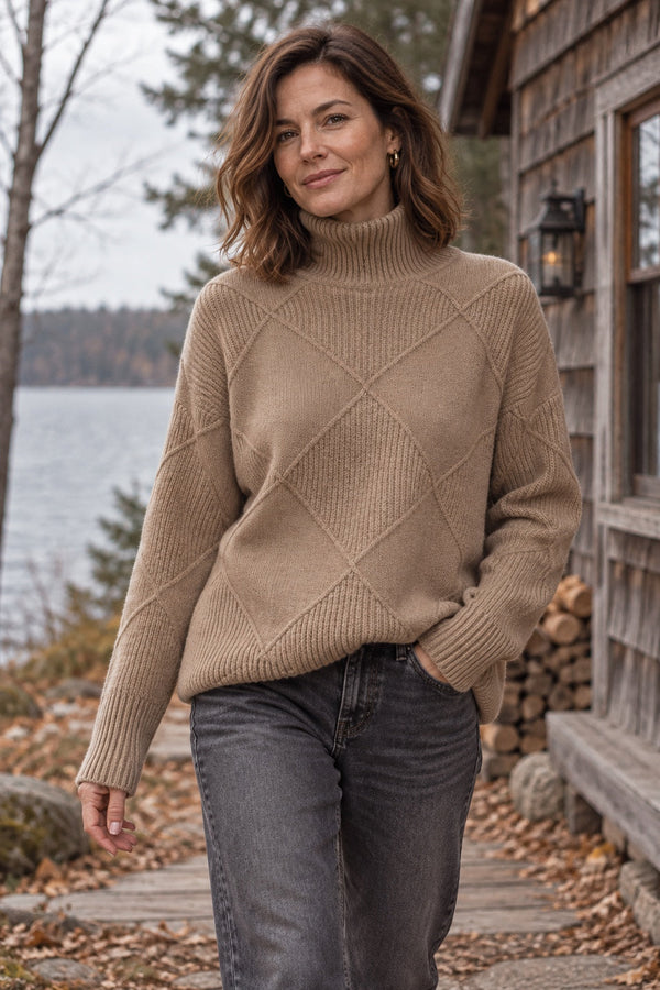 Woman in the Emberline Pullover by a lake