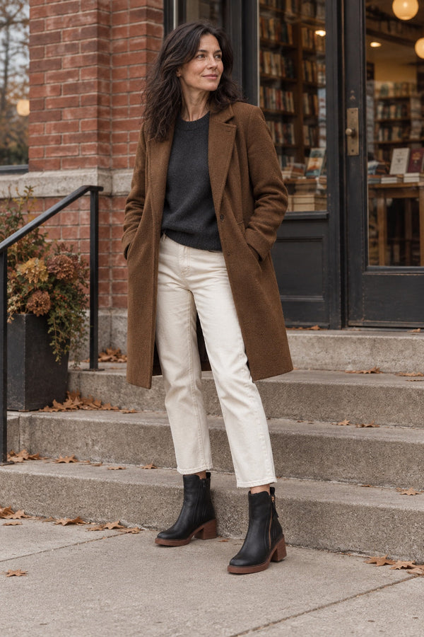 Woman in Raven Side-Zip Block Heels outside a bookshop