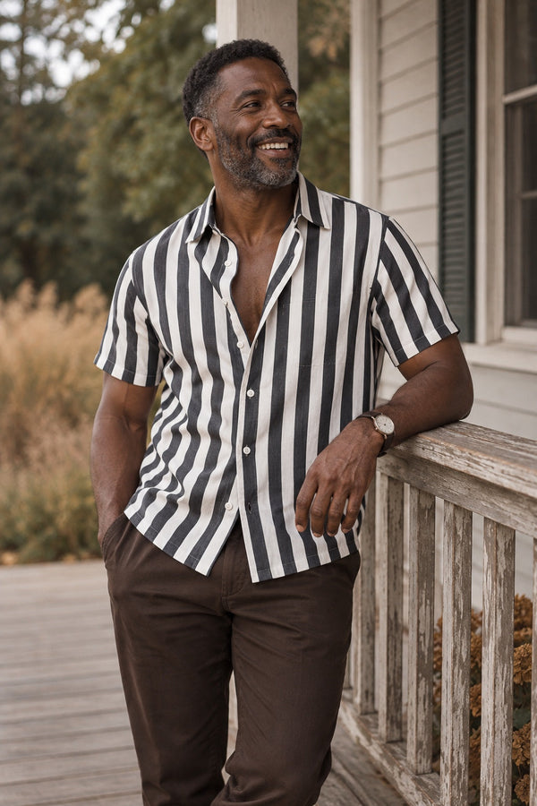Man in the Coastline Short Sleeve shirt on a porch